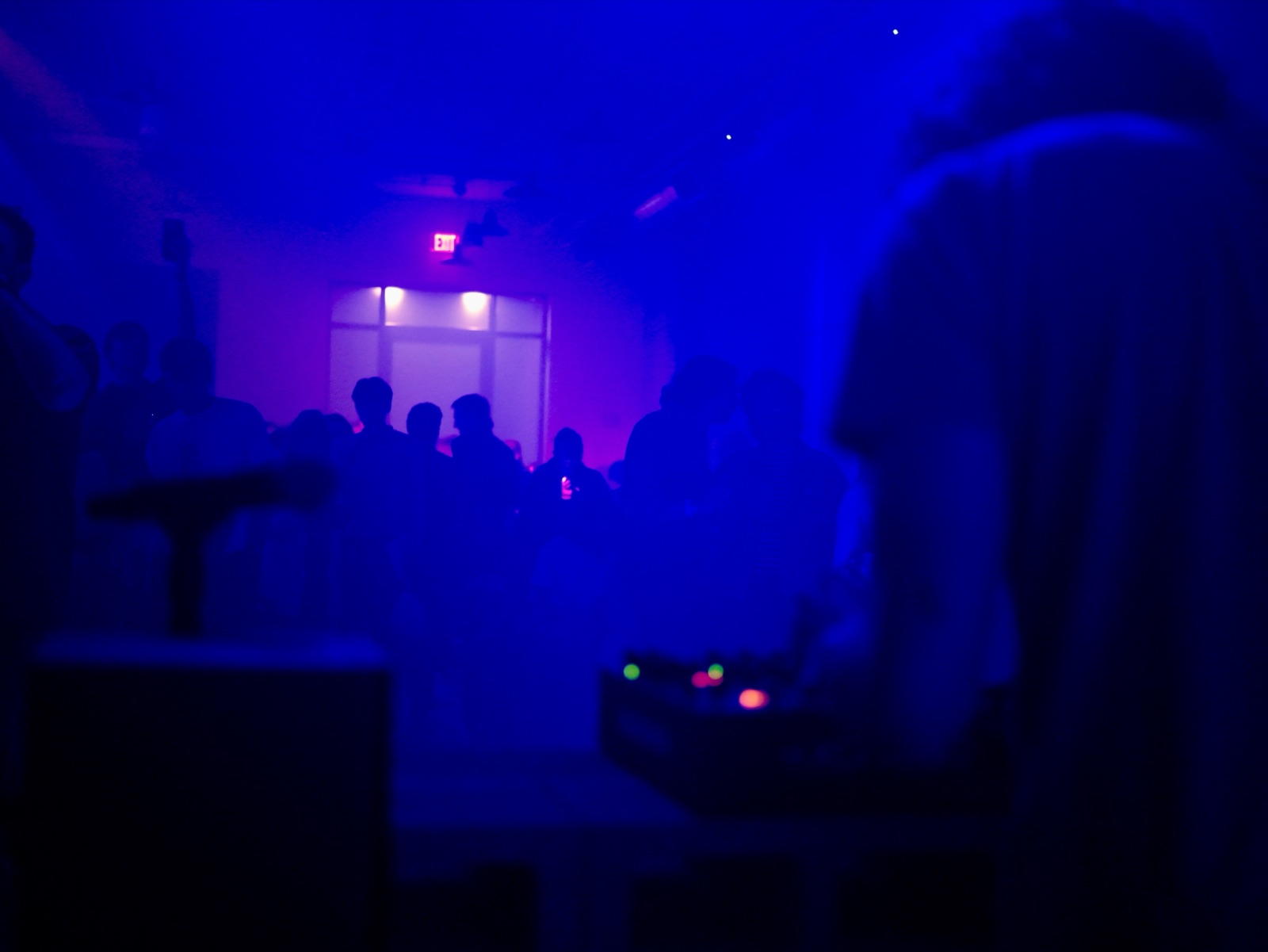 The 9 p.m. set in the garage — smoke and blue light